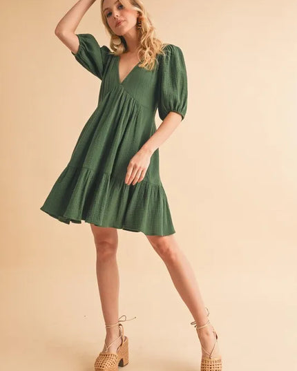 Aemi+Co Tied Back Ruffled Short Sleeve Mini Dress.