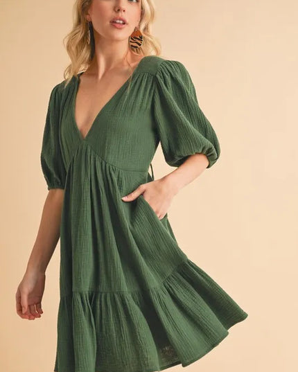 Aemi+Co Tied Back Ruffled Short Sleeve Mini Dress.