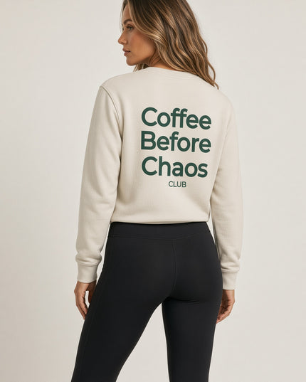 Back view of the Tuvi Coffee Before Chaos crewneck sweatshirt in Camel, showing the large dark green Coffee Before Chaos Club print.