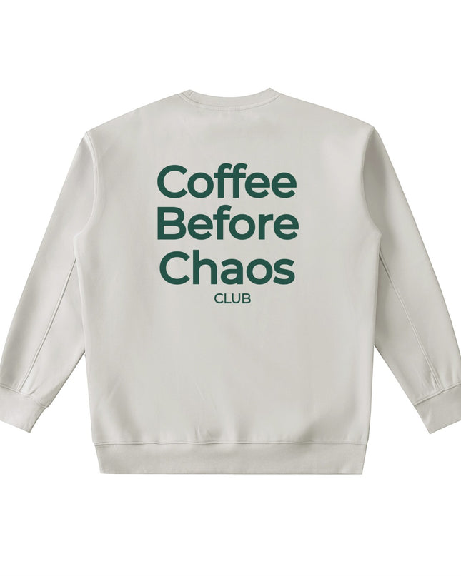Tuvi Coffee Before Chaos crewneck sweatshirt in beige with dark green text on the back.