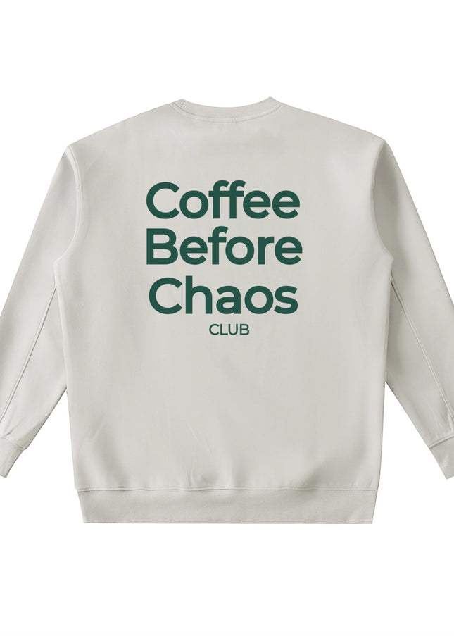 Tuvi Coffee Before Chaos crewneck sweatshirt in beige with dark green text on the back.